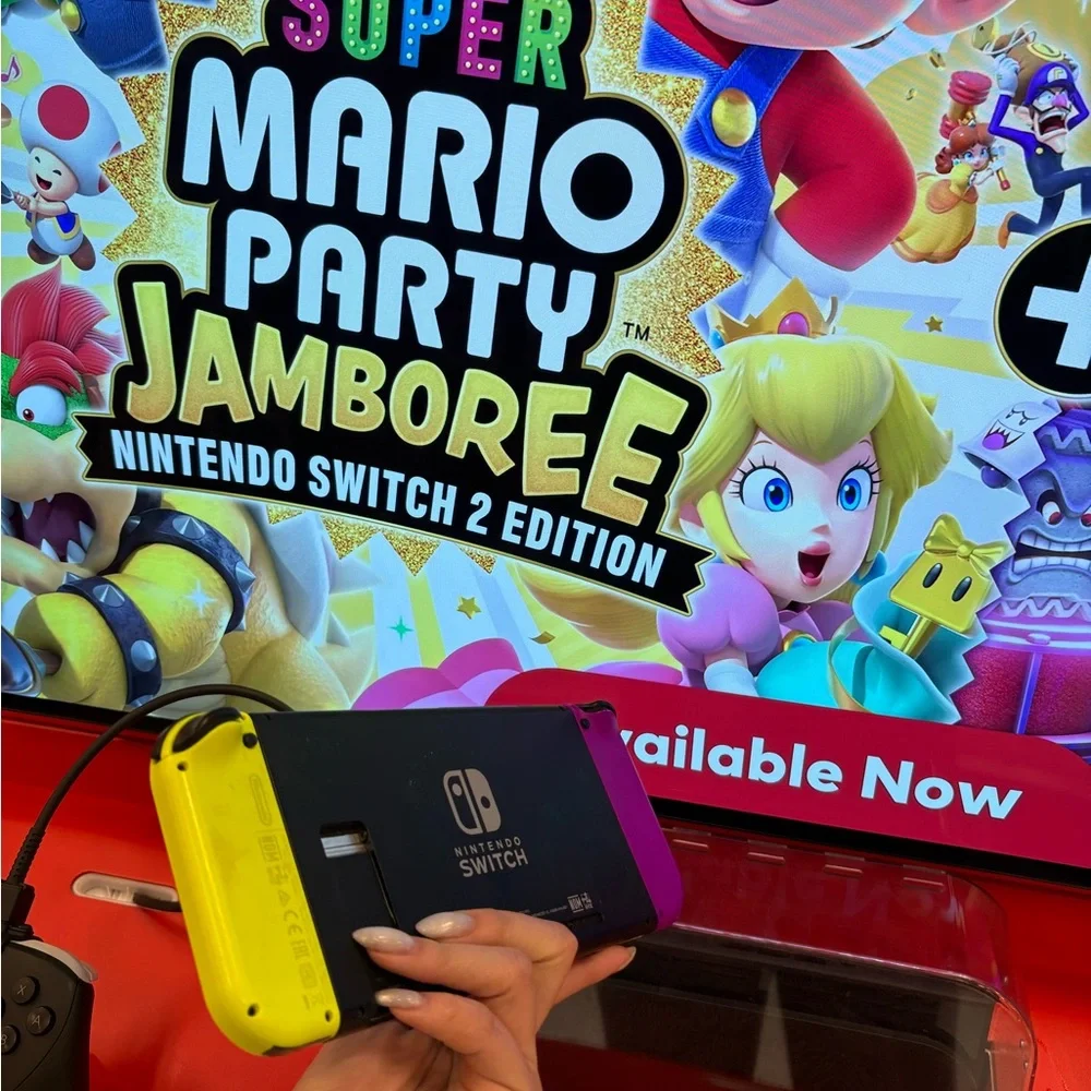 Nintendo Switch with Vibrant Purple and Yellow Joy-Con free games